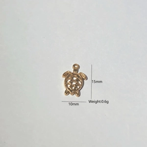Detailed view of a gold hollow turtle pendant showing 15mm height and 10mm width dimensions