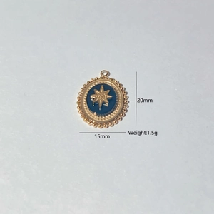 Detail of 15mm gold star pendant with blue disc including product size and weight