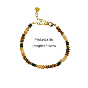 Detailed shot of tiger eye beaded bracelet with gold heart pendant and size info