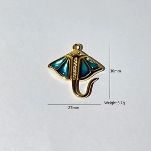 Detail of a 30mm gold stingray pendant with blue enamel and sparkling white zircons