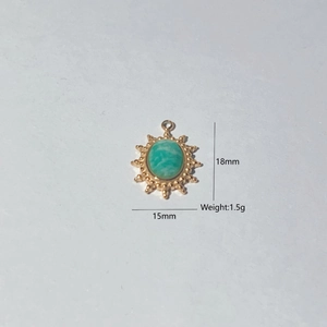 Macro shot of 18mm sunburst gold pendant with inlaid natural green stone for DIY jewelry