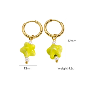 Detailed view of green star pendant earrings with pearls and 37mm length measurement