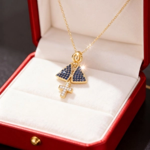 Edle Goldkette mit blauem Saphir Maria-Anhänger und kleinem Diamantkreuz-Anhänger