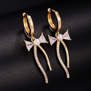 Boucles d'Oreilles Élégantes en Cuivre avec Nœud Papillon et Gland en Zircon pour Femmes Dorées avec Künstliche Perle de Synthèse Bijoux Chic