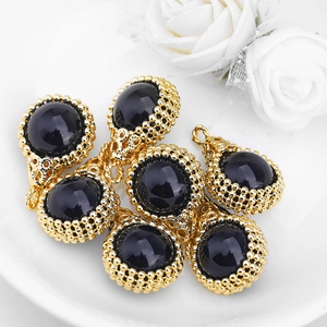 Set of vintage gold pendants with black gemstones and bead trim for DIY jewelry