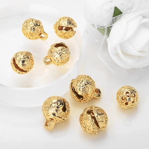 Golden hollowed metal bell pendants with carved star patterns for DIY jewelry design
