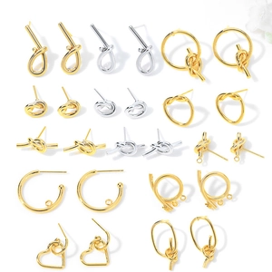 Assorted gold and silver metal earring components in geometric DIY jewelry styles