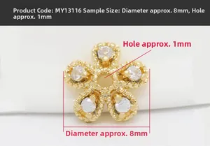 Macro shot of gold-plated five-petal flower bead cap with sparkling cubic zirconia
