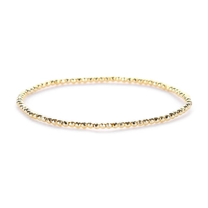 Detailed view of faceted 14K gold-plated beaded elastic bracelet with metallic luster