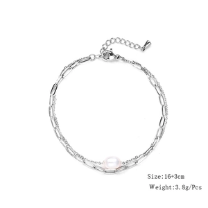 Close-up of dual-layer stainless steel paperclip chain bracelet with a freshwater pearl