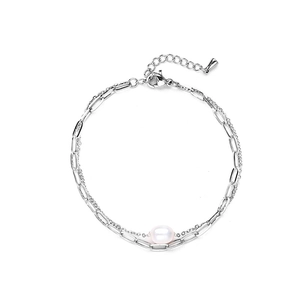 Silver paperclip and round link chain bracelet with freshwater pearl on white background