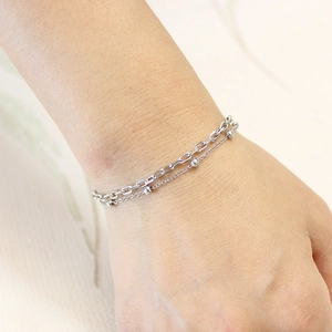 Double-layered silver stainless steel bracelet featuring paperclip and bead chain design