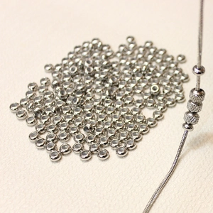 Polished silver stainless steel beads with knurled texture on a snake chain for jewelry DIY