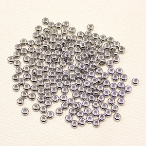 Pile of stainless steel spacer beads with rubber core inserts for jewelry making