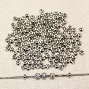DIY stainless steel spacer beads set with textured stopper beads on silver snake chain