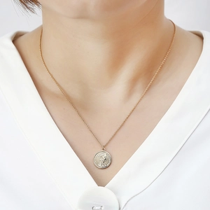 Elegant rose gold necklace with a double-sided coin pendant featuring a queen portrait