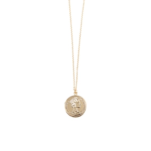 Close-up of rose gold coin necklace featuring Queen Elizabeth II portrait and relief detail