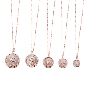 Detailed view of rose gold coin necklaces with Queen Elizabeth II relief in five sizes