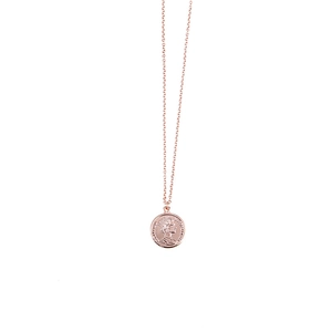 Close-up of rose gold coin necklace featuring Queen Elizabeth II portrait relief