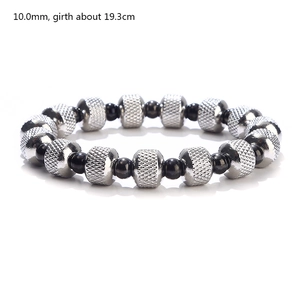 Detail showing 10mm black and knurled silver beads of a waterproof stretch bracelet