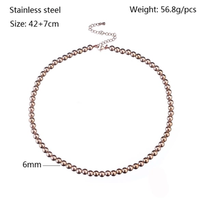 Close-up of 6mm polished rose gold stainless steel bead necklace with lobster clasp