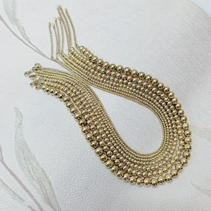 Detail view of rose gold stainless steel bead necklaces in various sizes with lobster clasps