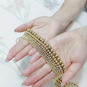 Detail showing various sizes of rose gold stainless steel bead chains with mirror finish