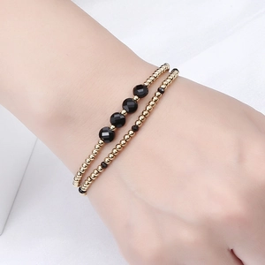 Double-layer handmade beaded bracelet with golden steel beads and black faceted crystals