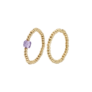 Close-up of golden beaded stainless steel rings with a square purple zircon gemstone