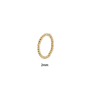 Detailed view of a 2mm stainless steel beaded elastic ring with a minimalist ball design