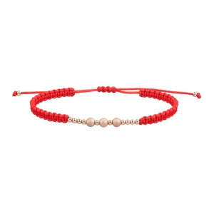 Detail of red braided cord bracelet with matte and polished gold-plated beads