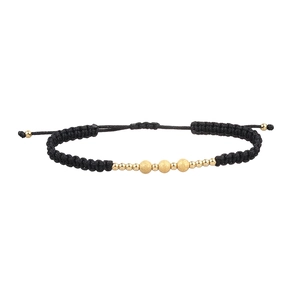 Detail of adjustable black woven cord bracelet with matte and polished gold beads