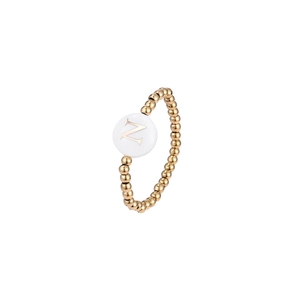 Detail of beaded elastic ring with a gold letter N shell charm and waterproof metal beads