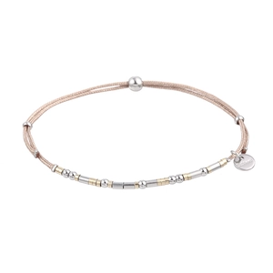 Detail of adjustable woven cord bracelet with stainless steel beads and logo tag