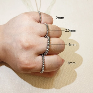 Detail view of four silver beaded stainless steel rings in sizes 2mm, 2.5mm, 3mm, and 4mm