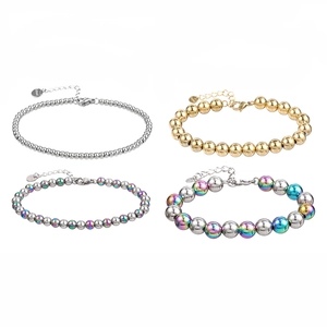 Bracelets à billes en acier inoxydable poli or et argent avec fermoir mousqueton et breloques