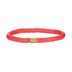 Detail of red Heishi clay bead bracelet with a gold-toned ribbed metal spacer bead