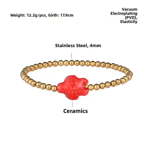 Detail of waterproof stainless steel beaded bracelet with red ceramic cloud charm