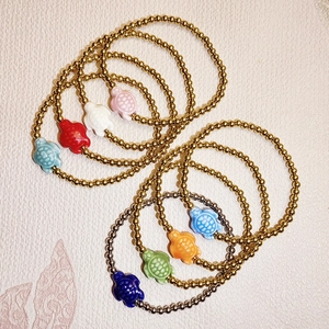 Waterproof titanium steel beaded bracelets featuring colorful ceramic sea turtle charms