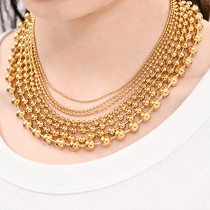 Multilayered gold stainless steel ball bead necklace with shiny mirror-polished finish