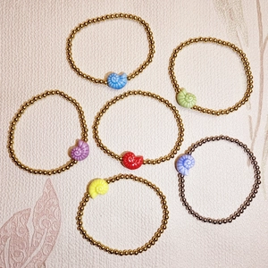 6-piece ocean set beaded bracelets with colorful ceramic sea snail charms and steel beads