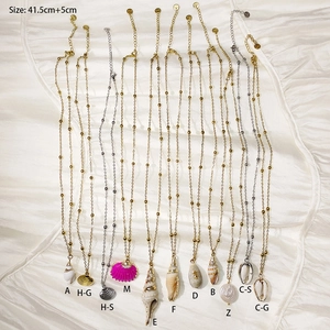 Detail view of shell and conch necklaces with adjustable length and sizing information