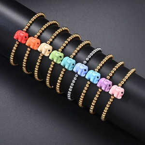 Close-up of multicolored elephant charms on stainless steel beaded bracelets set