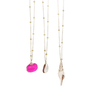 Detailed view of three ocean-style shell necklaces featuring pink scallop and gold chains