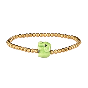 Detail of a gold beaded bracelet featuring a charming green ceramic elephant charm