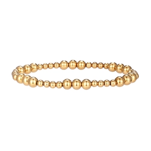 Dettaglio di un bracciale in acciaio placcato oro lucido con perline di dimensioni alternate