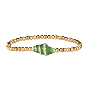 Detail of waterproof gold beaded bracelet with a green ceramic conch shell charm