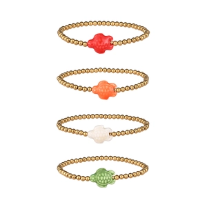 Set of four gold beaded bracelets featuring colorful sea turtle pendants in vibrant summer style