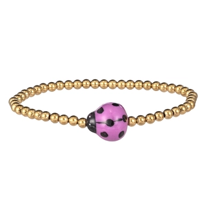Detailed close-up of golden beaded bracelet with a cute purple ladybug charm