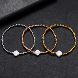 Three-piece beaded clover bracelets set in gold, rose gold, and silver finishes